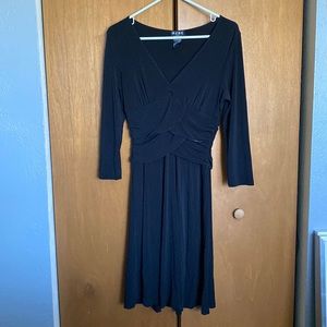 Black BCBG dress with layered waist detail and 3/4 length sleeves hits at knee.